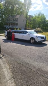 Black luxury limousine waiting at an Atlanta wedding venue