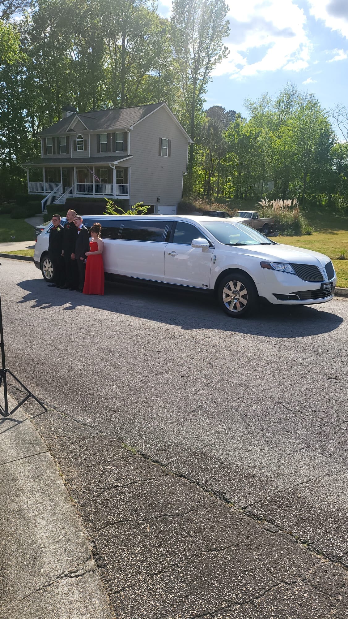 Black luxury limousine waiting at an Atlanta wedding venue